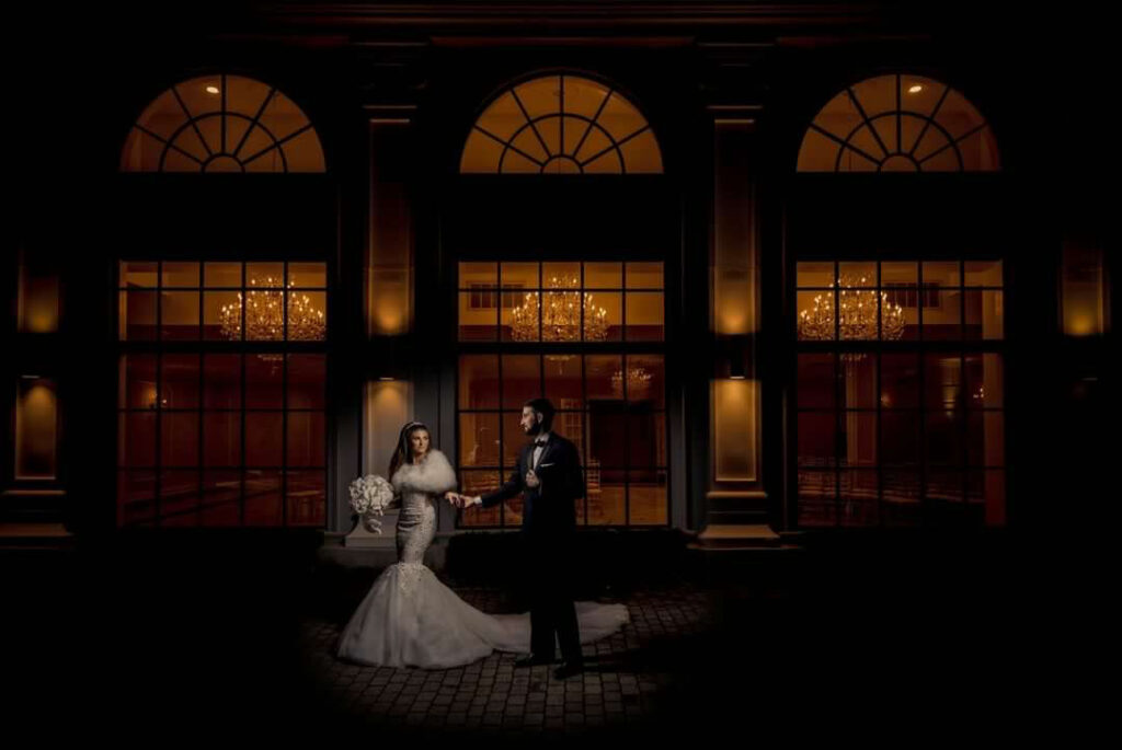 Outdoor nighttime picture of bride and groom at The Addison Park