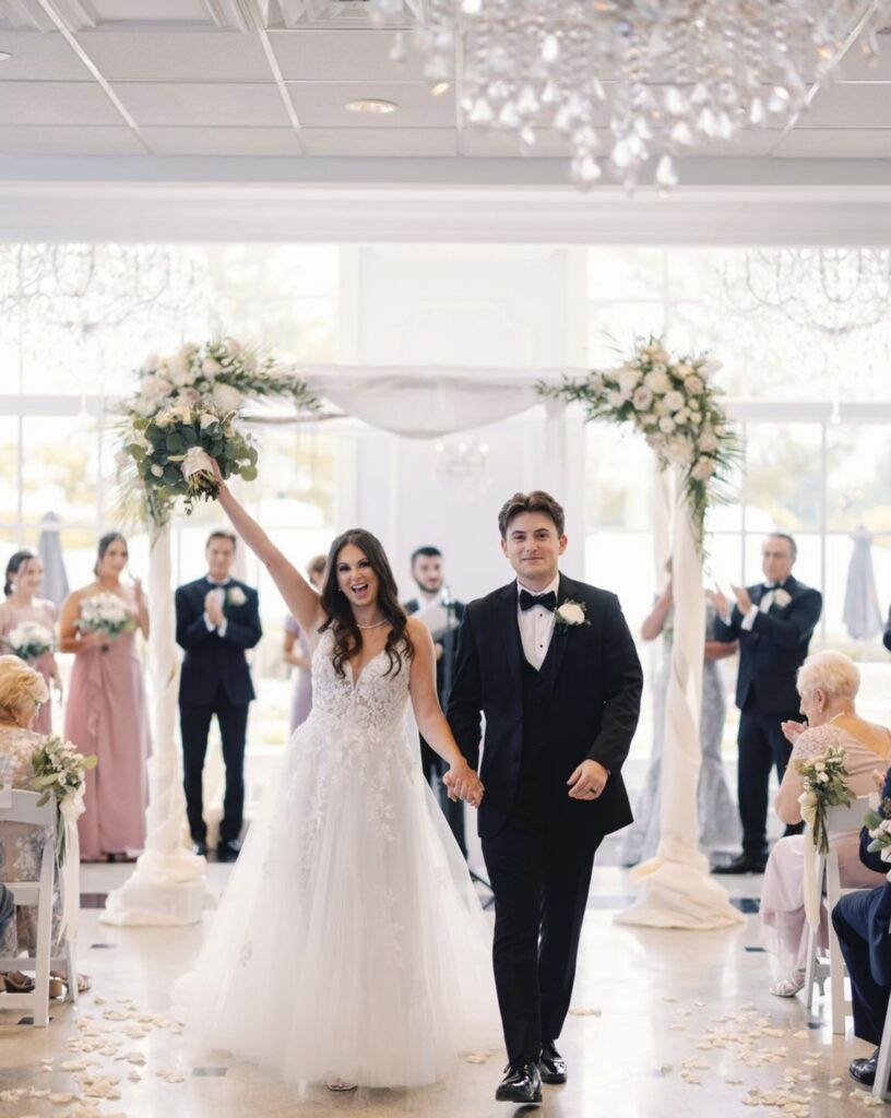 The Addison Park bride and groom walking in